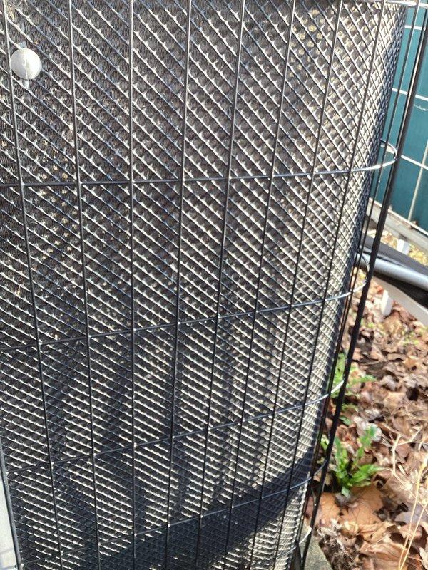 Completed scheduled AC tune-up and preventive maintenance on 19-year-old Lennox outdoor condensing unit. System was operational upon arrival. Performed comprehensive inspection of cylindrical outdoor unit, including examination of protective mesh casing, mounting hardware, and electrical connections. Cleared accumulated leaves and debris from base of unit and surrounding area to ensure proper airflow and drainage. Verified all mechanical components, refrigerant levels, and electrical connections were functioning within normal operating parameters.