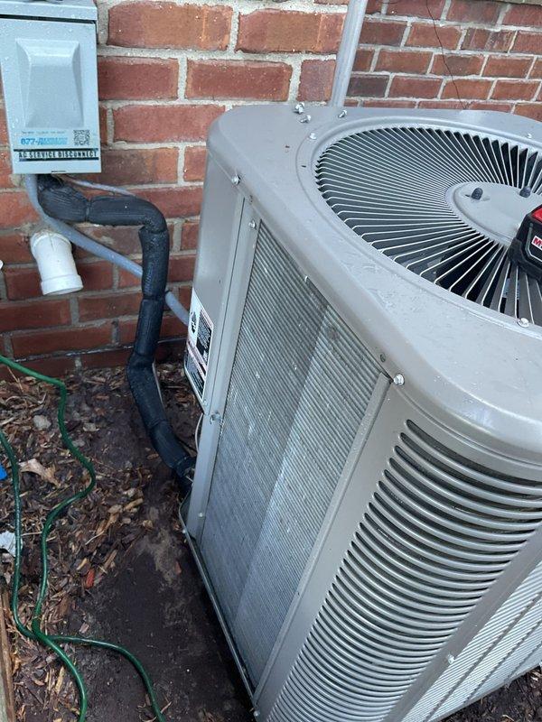Completed comprehensive ComfortGuard preventive maintenance service on residential split-system air conditioning unit. Performed full system inspection of outdoor condenser unit, verified proper operation of compressor and condenser fan motor, cleaned condenser coils, checked refrigerant line insulation integrity, and confirmed electrical disconnect box functionality. All components found operating within normal parameters with no deficiencies noted.