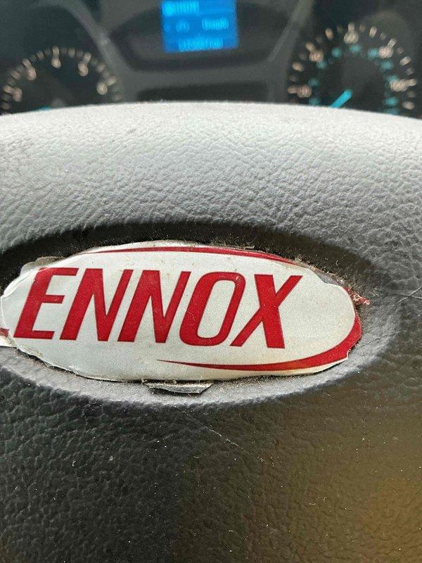 Responded to callback for violation repair on recently installed Lennox 70,000 BTU furnace and 2-ton AC system. Inspector cited NEC 440.14 and 110.26(A)(1)(2)(3) violation for insufficient clearance at AC condenser service disconnect, requiring 36 inches from grounded and ungrounded surfaces. Relocated electrical disconnect box on exterior brick wall to achieve proper clearance specifications and ensure code compliance. Installed whole home surge protector as additional scope item. Verified all electrical connections, tested system operation, and confirmed unit functionality with proper airflow through condenser louvers. Installation now meets all NEC requirements with disconnect accessible and properly positioned relative to condensing unit mounted on pad.