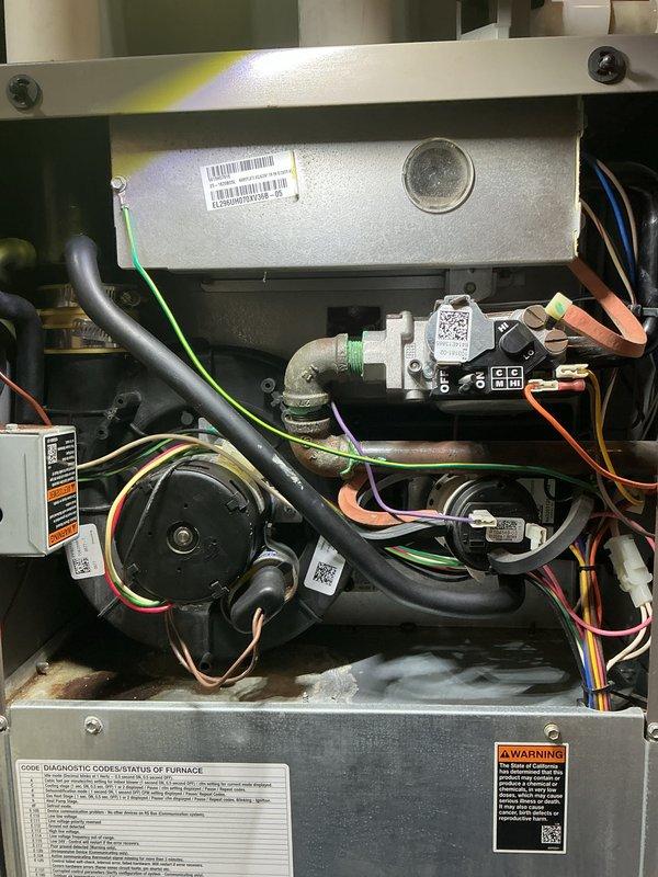 Completed routine maintenance on two air handling systems, performing comprehensive tune-ups on both the forced air furnace and air conditioning unit. Inspected all internal components including gas valve assembly, blower motor, electrical connections, and refrigerant lines. Verified proper operation of all mechanical and electrical systems, confirmed secure wiring connections with multi-colored control wires, and checked gas line connections at the white plastic valve assembly. Both systems tested and found to be functioning within normal operating parameters with no deficiencies noted at time of service.