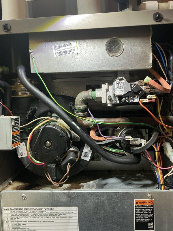 Completed routine maintenance on two air handling systems, performing comprehensive tune-ups on both the forced air furnace and air conditioning unit. Inspected all internal components including gas valve assembly, blower motor, electrical connections, and refrigerant lines. Verified proper operation of all mechanical and electrical systems, confirmed secure wiring connections with multi-colored control wires, and checked gas line connections at the white plastic valve assembly. Both systems tested and found to be functioning within normal operating parameters with no deficiencies noted at time of service.