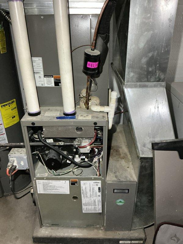Completed annual heating and cooling maintenance on residential HVAC system. Performed comprehensive inspection of gas furnace and air handler unit in mechanical room, checking blower motor assembly, electrical connections, and refrigerant lines. Inspected outdoor condensing unit, verified proper airflow through louvered panels, and confirmed operational status of all components. All equipment found to be functioning within normal parameters with no immediate service needs identified.