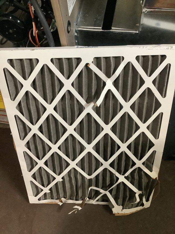 # HVAC Maintenance - ACM Completed

Performed routine air conditioning maintenance on outdoor condensing unit. Upon arrival, found the condenser coil heavily soiled with accumulated dirt, dust, and debris buildup affecting airflow and system efficiency. Thoroughly cleaned and washed condenser coil to restore proper heat transfer capability. Replaced dirty air filter with new filter, as evidenced by comparison of heavily soiled original filter against fresh replacement. Inspected unit pad and verified stable positioning on concrete base. System operational following maintenance completion.
