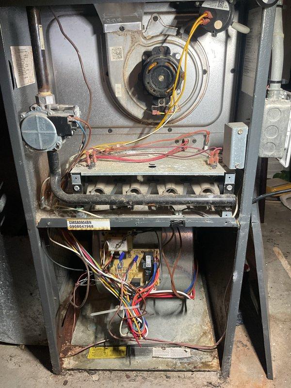 Completed annual furnace and air conditioning maintenance tune-up on residential Goodman HVAC system. Performed comprehensive inspection of gas furnace including blower motor assembly, heat exchanger, burner assembly, ignition components, and control board. Measured and verified electrical amperage draw at 0.40A using clamp meter to ensure proper motor operation. Inspected all electrical connections, gas manifold, and internal components for proper function and safety. System operating within normal parameters upon completion of maintenance procedures.