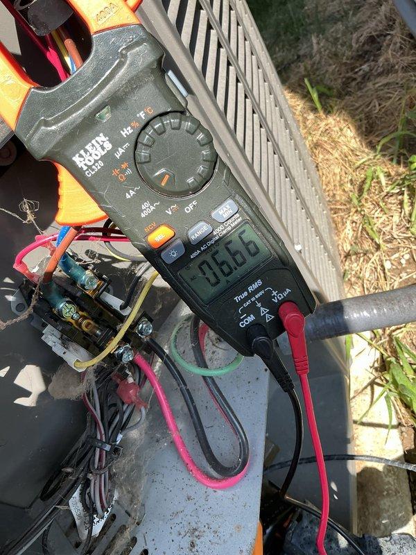 Completed routine ACM maintenance on residential cooling system, including replacement of air filter and evaporative cooler pad as scheduled. Performed diagnostic measurements on both indoor furnace unit and outdoor condensing unit, verifying electrical current draw of 0.063 amps at contactor and confirming gas valve assembly operation with multimeter reading of 133 millivolts at flame sensor circuit. All components operating within normal parameters, system left in proper working condition.