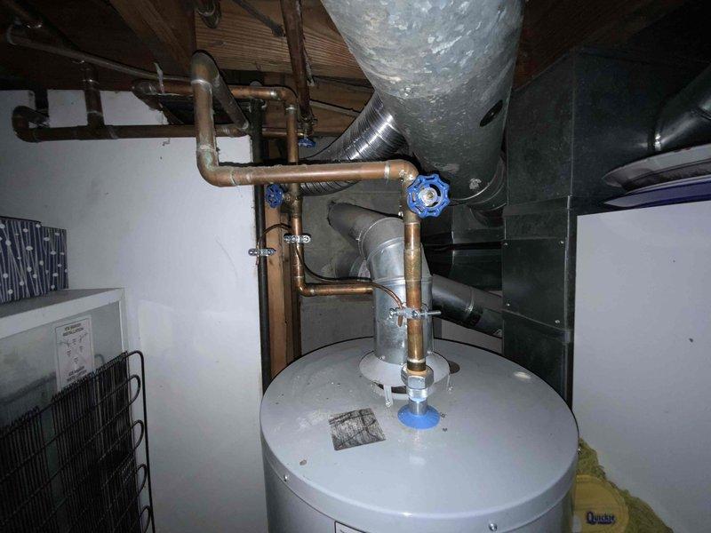 Provided estimate for replacement of 20+ year old furnace and air conditioning system located in basement mechanical room. Current equipment operational but at end of service life. Quote includes furnace and air handler replacement with associated ductwork modifications as needed for proper installation in existing utility space shared with water heater and other mechanical systems.