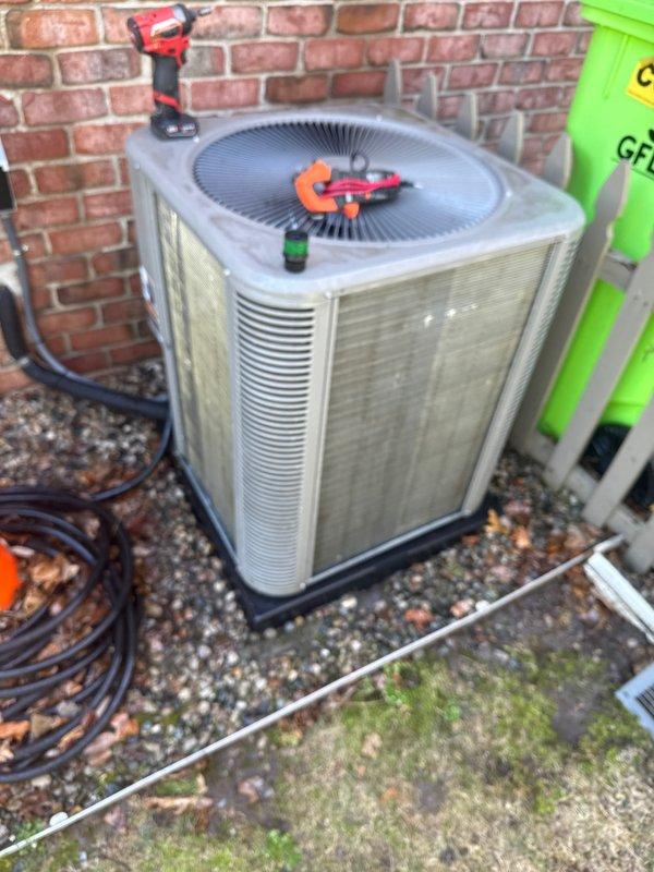 Completed annual cooling maintenance on residential air conditioning system. Performed thorough inspection of outdoor condenser unit, replaced air filter, and verified proper system operation. All refrigerant lines, electrical connections, and components found to be in good working condition with no issues identified.