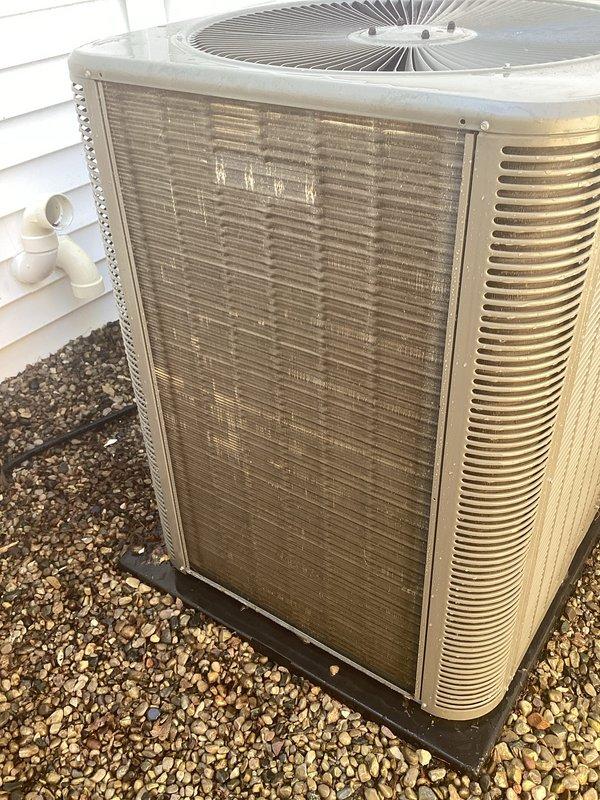Completed routine AC tune-up on one-year-old central air conditioning system with no reported issues. Performed comprehensive maintenance including inspection of outdoor condenser unit, verified proper operation of fan motor and compressor, checked refrigerant levels and pressures, cleaned condenser coils, inspected electrical connections and contactors, tested capacitors, verified proper drainage through condensate lines, and confirmed system cycling and temperature differential. Unit found in good operating condition with normal wear for age, positioned on proper pad with adequate clearance and drainage. All components functioning within manufacturer specifications.
