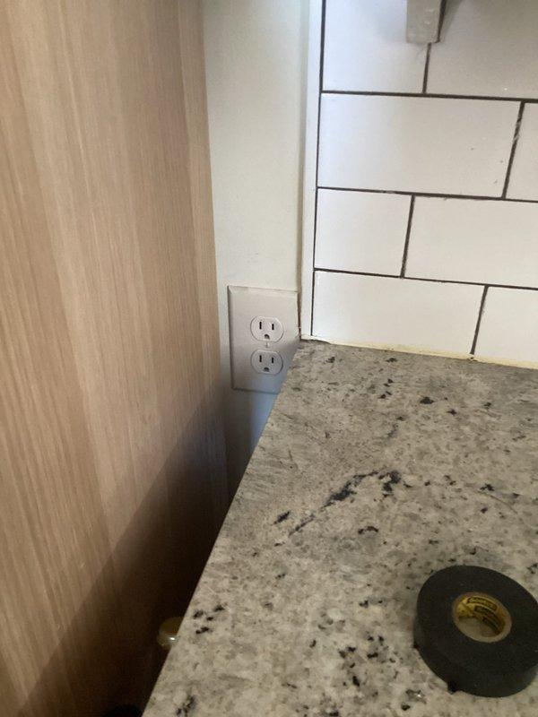 Responded to loss of power affecting multiple kitchen outlets and lighting circuits. Diagnosed tripped circuit breaker on main electrical panel serving kitchen branch circuits. Reset breaker, verified proper operation of garbage disposal unit, and tested all affected outlets and light fixtures to confirm power restoration. All circuits functioning normally upon completion.
