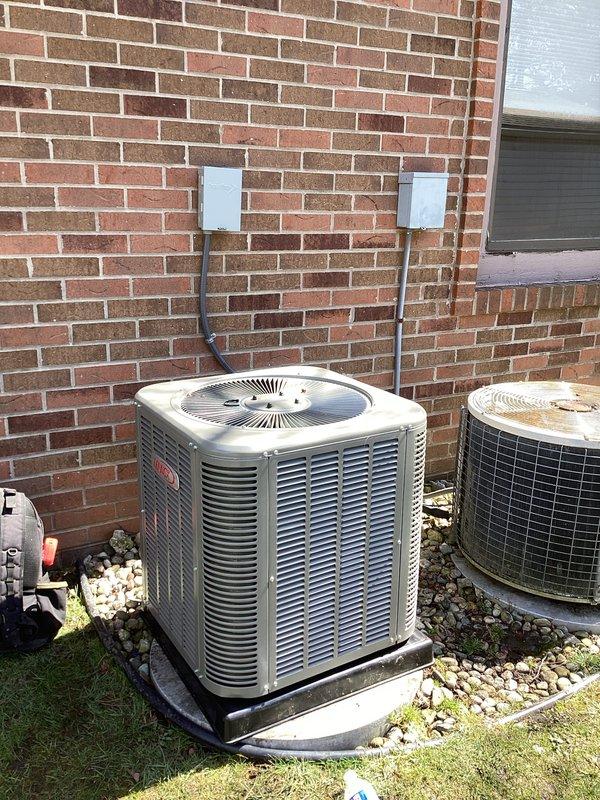 Completed full HVAC system installation including a 45,000 BTU furnace and 1.5 ton air conditioning unit. Removed existing aged outdoor condenser unit and installed new replacement unit on concrete pad with proper refrigerant line connections and electrical hookup. Installed new furnace in basement utility area with complete ductwork integration, including flexible and rigid metallic ducting for optimal airflow distribution. Ran copper refrigerant lines with insulation sleeves from outdoor condenser to indoor air handler, securing lines to exterior brick wall with protective conduit boxes. Installed PVC condensate drain piping and venting systems per code requirements. Reconnected all ductwork to existing distribution system and verified proper sealing at all connections. System startup performed with verification of proper refrigerant charge, airflow measurements, and thermostat operation. All mechanical permits obtained and installation completed to manufacturer specifications and lo