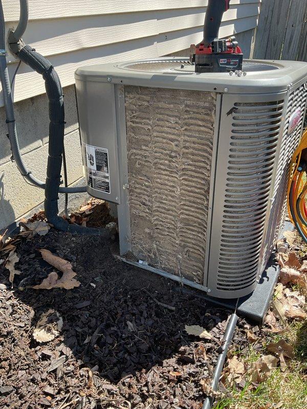 Completed annual cooling maintenance on residential AC condenser unit. Inspected and cleaned heavily soiled evaporator coil showing significant dirt and debris accumulation, performed system diagnostics using manifold gauges to verify refrigerant pressures and temperatures within manufacturer specifications, and documented all readings for service records.