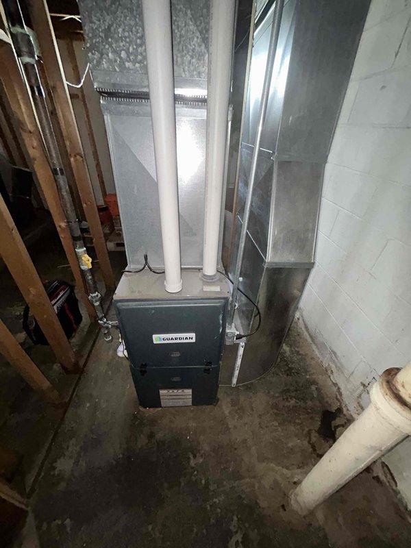 Conducted comprehensive assessment of non-operational basement HVAC system with 9-year-old equipment including Guardian furnace and air conditioning unit. Evaluated existing ductwork configuration, PVC venting system, and overall mechanical installation to provide complete replacement estimate for natural gas heating and cooling system. Documented current equipment conditions and spatial requirements, prepared detailed written proposal for full system replacement per customer request.