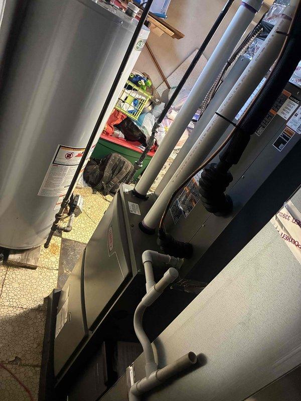 Completed full HVAC system installation including a 90,000 BTU furnace and 3-ton rear-discharge air conditioning unit in basement mechanical room. Installation included humidifier integration, duct liner application, and reconnection of all existing utilities and ductwork. Obtained mechanical and electrical permits prior to installation, ensuring all work meets code requirements and manufacturer specifications for optimal system performance and efficiency.