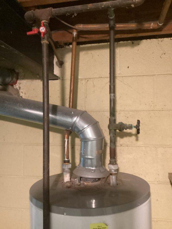 Completed comprehensive whole home electrical inspection on 1964-built residence with no specific concerns reported. Performed thorough evaluation of main electrical panel located in basement utility area, documenting breaker configuration, circuit directory, and overall panel condition. Inspected all visible electrical components including junction boxes, conduit runs, and wiring throughout accessible areas. Assessed electrical infrastructure in mechanical room including connections to water heater and associated utility equipment. Documented all findings with photographs for customer records.