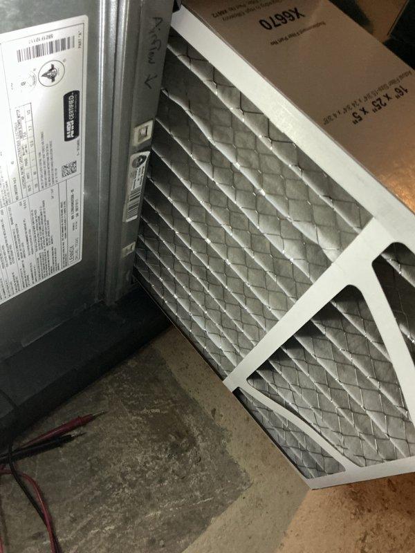 Performed routine HVAC maintenance including replacement of pleated air filters on the air handler unit. Conducted electrical diagnostics on the outdoor condensing unit using a digital clamp meter, verifying proper amperage draw and system performance. Inspected condenser coil condition and noted minor debris accumulation on exterior components.
