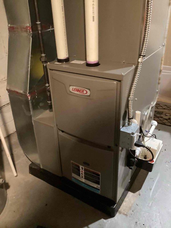 Completed annual maintenance tune-up on Lennox furnace system. Performed comprehensive inspection of all internal components including blower motor, heat exchanger, gas valve, ignition system, and electrical connections. Verified proper operation of intake and exhaust venting through PVC piping, checked condensate drain line for proper flow, and confirmed all safety controls functioning correctly. Inspected ductwork connections and verified system is operating within manufacturer specifications with no issues found.