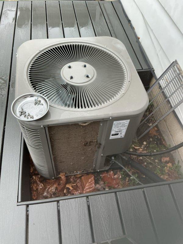 Completed annual cooling maintenance on residential HVAC system. Performed comprehensive inspection of outdoor condenser unit, which showed significant accumulation of leaves, debris, and vegetation growth on surrounding platform area. Cleaned condenser coils and surrounding area to restore proper airflow and system efficiency. Replaced 20x25x5 furnace filter (X6673) inside the home. Inspected all electrical connections, refrigerant lines, and mechanical components for proper operation. Verified system functionality and confirmed unit is operating within manufacturer specifications for the cooling season.