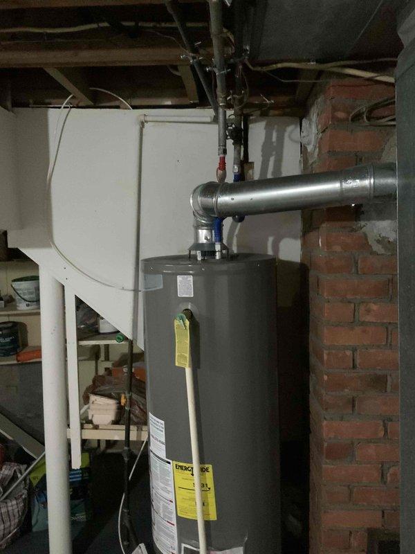 Provided estimate for replacement of non-operational gas furnace located in basement mechanical room. Existing unit is very old and no longer functioning, requiring complete system replacement. Assessment included evaluation of current ductwork, venting requirements, and available space for new equipment installation in unfinished basement area with exposed joists.