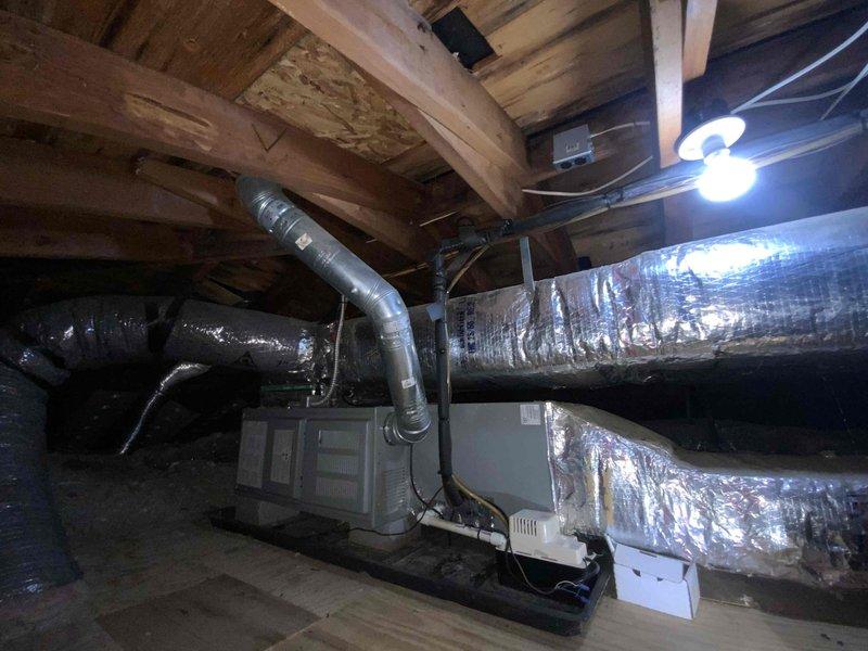 Completed full system HVAC estimate for 23-year-old non-operational residential heating and cooling system located in attic space. Assessed existing air handler unit, ductwork configuration, and overall system layout including flexible metallic ductwork distribution throughout the space. Documented current equipment condition, drain pan placement, and structural considerations for complete system replacement recommendation, with customer expressing interest in available financing options.