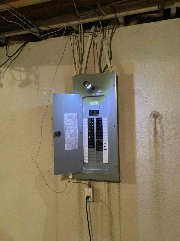 Conducted site evaluation and provided free estimate for Generac whole-house generator installation at approximately 20-year-old residence with no existing generator system. Assessed existing 200-amp electrical service panel, documented current electrical infrastructure including circuit breaker configuration and available capacity, and photographed panel location in basement utility area to determine optimal transfer switch placement and load requirements for generator integration.