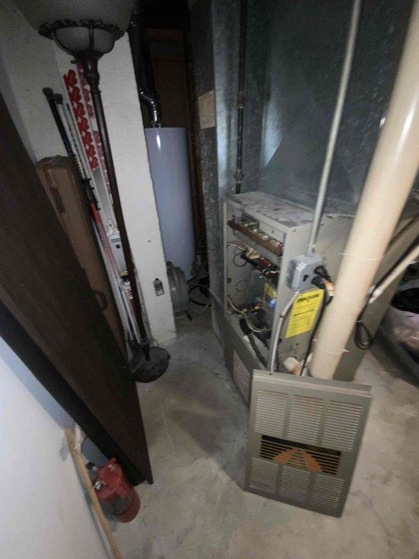 Conducted comprehensive full system estimate for 16-year-old HVAC system including furnace and air conditioning unit located in basement mechanical room. Performed thorough assessment of existing gray sheet metal furnace/air handler, associated ductwork, PVC condensate drainage lines, copper refrigerant tubing, and electrical connections. Documented current system configuration with detailed photography showing equipment condition, spatial constraints, and existing infrastructure including metal supply/return ductwork extending to ceiling distribution system. Provided replacement recommendations and equipment specifications for complete HVAC system upgrade to meet immediate replacement timeline within the month.