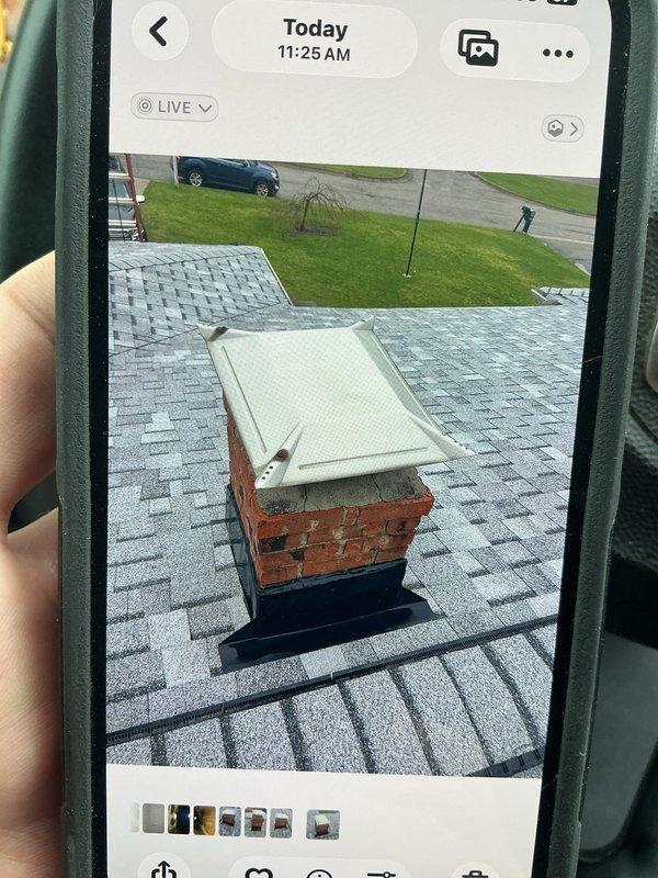 Responded to callback for reported water leak following recent HVAC installation. Upon arrival, conducted thorough inspection of exterior components and roof penetrations. Investigation revealed leak source at chimney chase cover and flashing interface where condensate line routing intersected with existing structure. Documented conditions with photographic evidence showing chimney cap, brick chimney construction, and roof shingle interface points. Identified compromised seal at metal chase cover allowing water intrusion during recent weather events. Coordinated findings with field supervisor for resolution planning and customer communication regarding necessary corrective measures to address leak source and prevent future water damage.