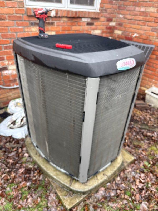 # HVAC Maintenance - ACM Completed

Performed scheduled preventive maintenance on residential Lennox air conditioning condensing unit. Conducted comprehensive inspection of outdoor equipment, checking all accessible components for proper operation and wear. Unit exterior showed significant weathering and age-related deterioration with visible discoloration and water staining on metal panels, though structural integrity remained intact.

Removed top grille to access internal components for cleaning and inspection. Verified condenser coil condition, checked refrigerant lines for leaks or damage, and inspected electrical connections for corrosion or loose terminals. Cleaned debris from unit surroundings and ensured adequate airflow clearance around equipment. All mechanical and electrical components found functioning within normal parameters. Unit operational and ready for continued service under ongoing maintenance agreement.