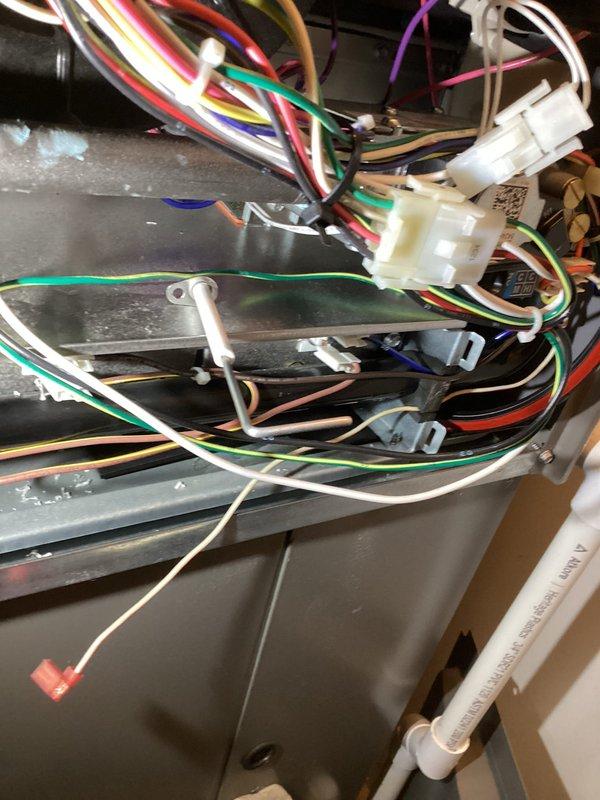 Completed scheduled Air Care Heating and Cooling maintenance on HVAC system. Performed comprehensive inspection of indoor furnace unit, verifying all electrical connections, wire terminations, and control components for proper operation. Inspected outdoor condensing unit, examining heat exchanger coil condition, capacitor connections, and overall system components. Documented equipment condition with photographs showing internal wiring configuration and outdoor unit accessibility for maintenance records.