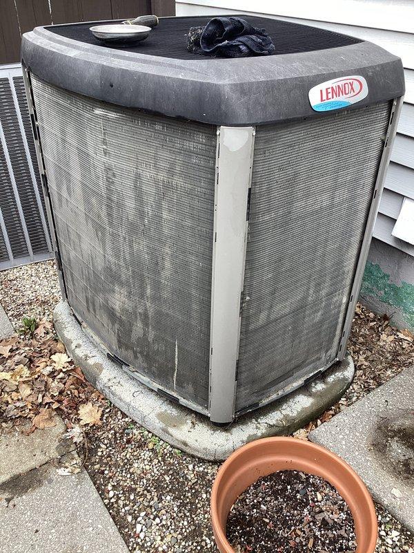 Completed annual cooling maintenance on Lennox condensing unit. Performed comprehensive inspection of outdoor unit, confirmed operational status of all components, and documented heavy dirt and debris accumulation on condenser coils and fins requiring future cleaning attention. Unit is currently functional with all safety systems operating within normal parameters.