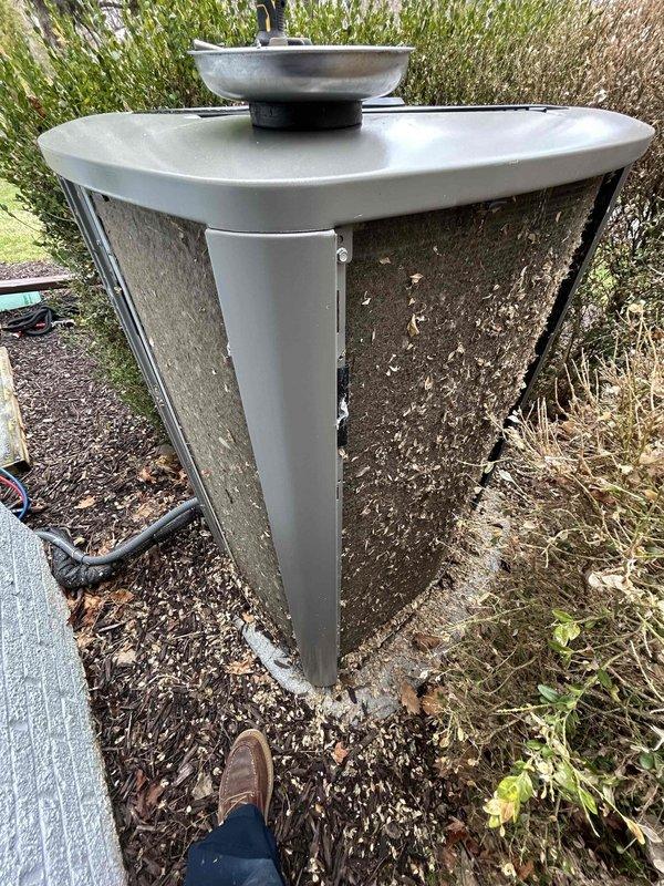 Performed routine air conditioning maintenance on two outdoor condenser units. Inspected both systems, cleaned exterior surfaces and coils of accumulated debris including leaves and organic matter, checked refrigerant lines and electrical connections, and verified proper operation of both units to ensure optimal cooling performance for the upcoming season.