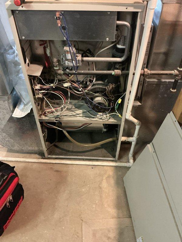 Responded to no heat call on Frigidaire RC-92+ forced air upflow furnace. Upon arrival, confirmed unit was attempting to start but shutting down before blower operation, resulting in no heat to structure. Removed access panel and performed diagnostic inspection of internal components including heat exchanger, ignition system, electrical wiring, and blower assembly. Inspected burner assembly, flame sensor, pressure switches, and gas valve connections. Checked all safety controls and limit switches for proper operation. Documented internal component configuration and overall system condition with photographs for service records.