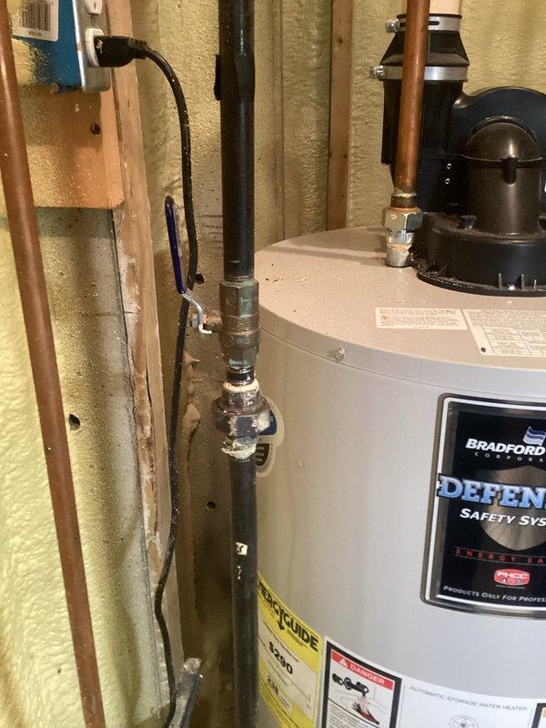 Completed annual cooling maintenance on residential HVAC system. Replaced air filter and evaporator pad as requested. Inspected and photographed water heater installation in utility area, noting proper Bradford White Defender unit operation with functional safety systems, appropriate copper piping connections, and adequate spray foam insulation throughout mechanical room.