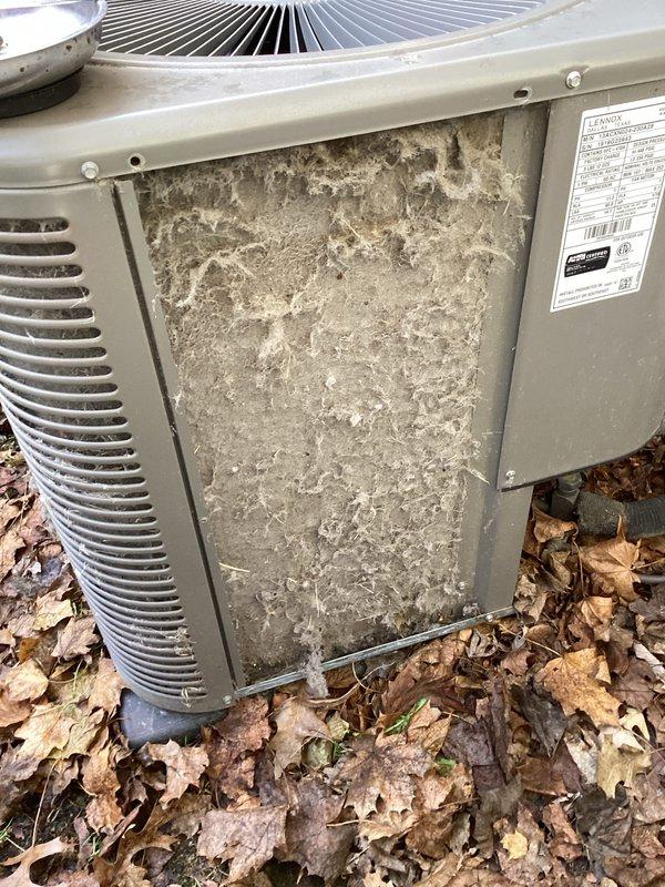 Completed annual cooling maintenance on outdoor condensing unit. Unit exterior and condenser coil showed heavy accumulation of dirt, dust, and debris from extended environmental exposure. Cleaned condenser coil fins thoroughly to restore proper airflow and heat transfer efficiency. Removed debris buildup from unit exterior panels and surrounding base area. Inspected fan assembly and verified operational condition. System restored to optimal performance standards following maintenance procedures.