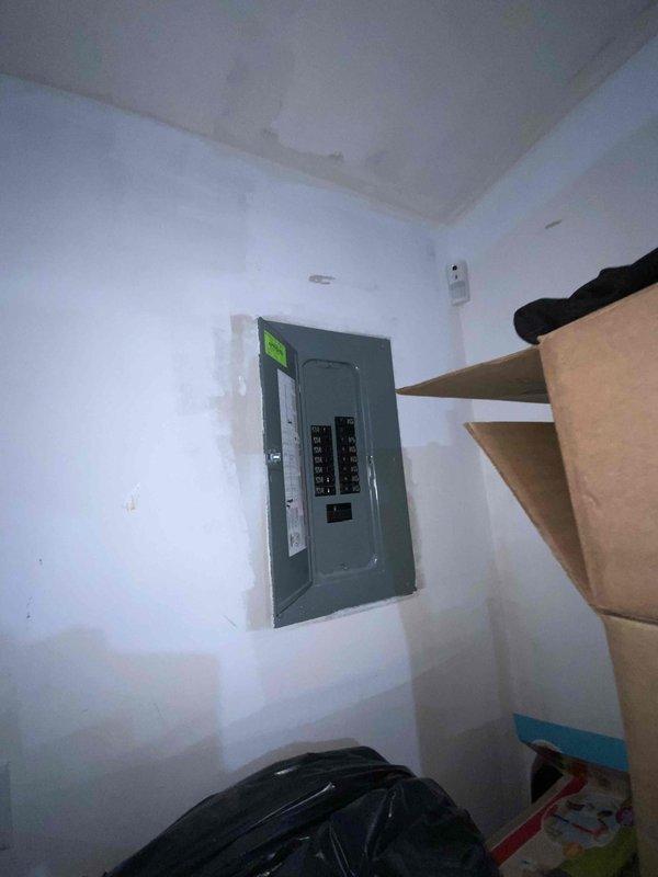 Conducted site assessment for central air conditioning system installation and backup generator at residential property currently without AC. Evaluated electrical panel capacity and infrastructure to determine compatibility for both AC unit and generator installation, photographing existing electrical service for load calculations. Provided comprehensive estimate options for air conditioning equipment and generator systems, including both Kohler and Generac models per homeowner's request.
