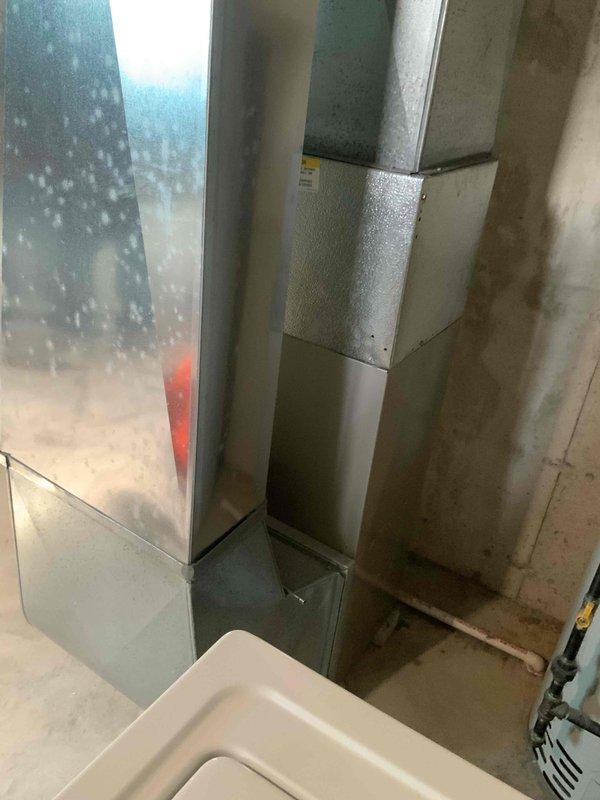 Completed on-site assessment for condo unit requiring replacement estimates for aging HVAC system and water heating equipment. Evaluated 20+ year-old gas furnace experiencing intermittent starting issues, inspected existing central air conditioning unit and ductwork system, and assessed hot water tank with service history dating to 2005-2006. Documented equipment conditions through photographic documentation of basement mechanical room, including furnace cabinet, aluminum flex ductwork connections, condensate components, and copper piping. Provided comprehensive replacement options for all three systems to address reliability concerns and equipment lifecycle considerations.