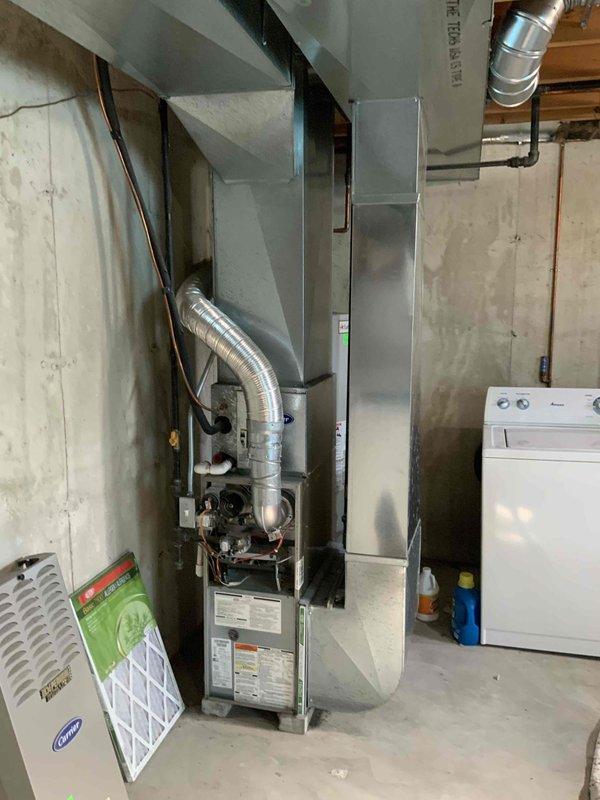 Completed on-site assessment for condo unit requiring replacement estimates for aging HVAC system and water heating equipment. Evaluated 20+ year-old gas furnace experiencing intermittent starting issues, inspected existing central air conditioning unit and ductwork system, and assessed hot water tank with service history dating to 2005-2006. Documented equipment conditions through photographic documentation of basement mechanical room, including furnace cabinet, aluminum flex ductwork connections, condensate components, and copper piping. Provided comprehensive replacement options for all three systems to address reliability concerns and equipment lifecycle considerations.