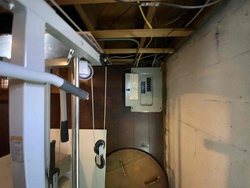 Conducted on-site assessment for tankless water heater installation in basement utility area to replace non-operational conventional tank-style water heater. Evaluated existing natural gas supply line, venting configuration, electrical requirements, and spatial constraints for tankless unit conversion, documenting current equipment conditions and mechanical systems layout to provide comprehensive estimate for equipment upgrade.