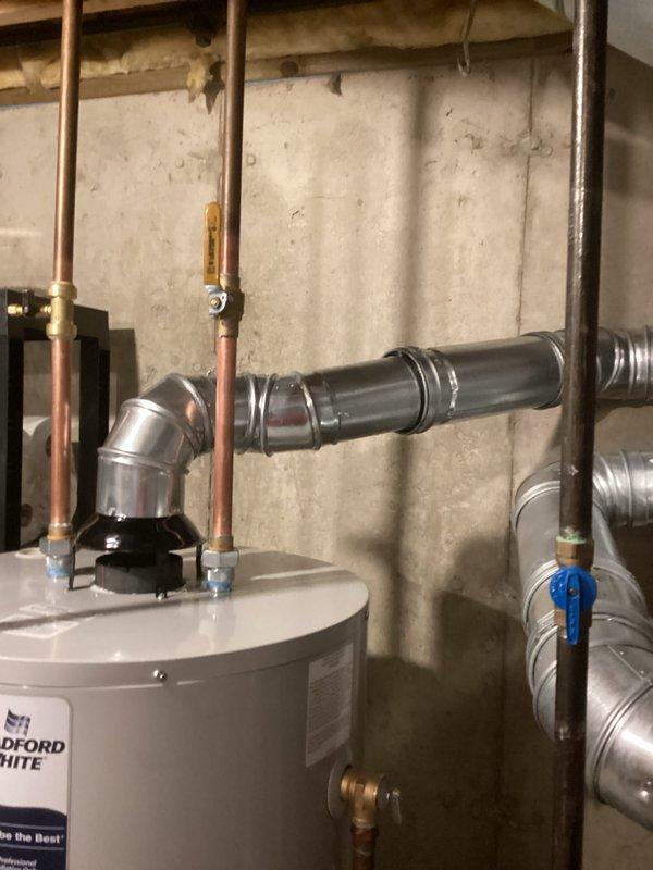 Installed a 50-gallon tanked water heater in basement utility area with complete reconnection of all plumbing and gas lines. Connected copper supply and discharge piping with appropriate shut-off valves, installed ICON System gas control unit with pilot assembly, and verified proper venting configuration. Permits requested for mechanical installation and hot water heater reconnection; unit tested and operational upon completion.