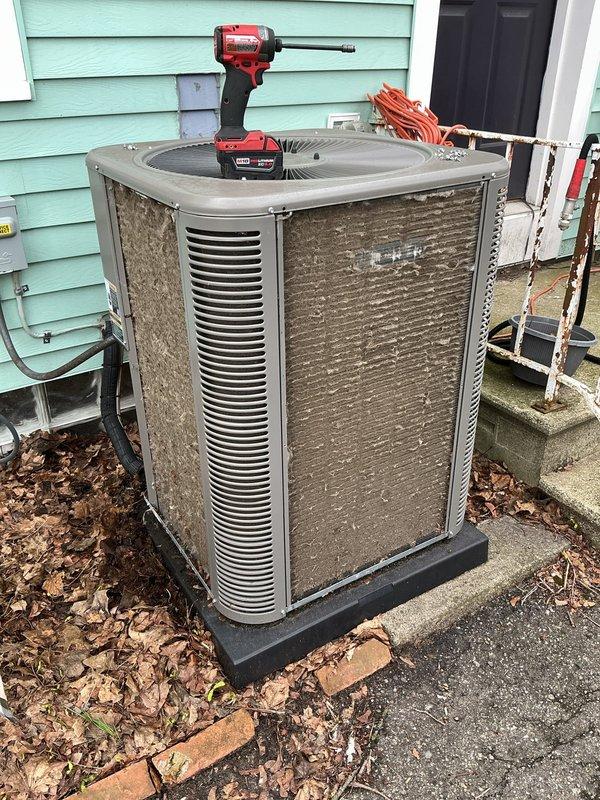 Completed scheduled Air Care Cooling maintenance on York brand outdoor condenser unit. Performed comprehensive system inspection, cleaning, and operational testing per ACM4/610-2 protocol. Unit showed typical weathering and dirt accumulation on exterior panels, with leaf debris present around base perimeter. Verified proper airflow through louvers, inspected electrical connections and conduit, confirmed unit stability on mounting pad, and ensured all components functioning within normal parameters.