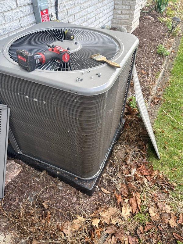Performed routine air conditioning maintenance visit on split system. Upon inspection, found evaporator coil heavily contaminated with accumulated dust, dirt, and debris significantly restricting airflow through fins. Thoroughly cleaned evaporator coil to restore proper heat transfer efficiency. Inspected outdoor condenser unit and cleared surrounding area of leaves and organic debris. Verified unit operation and airflow upon completion of maintenance procedures.