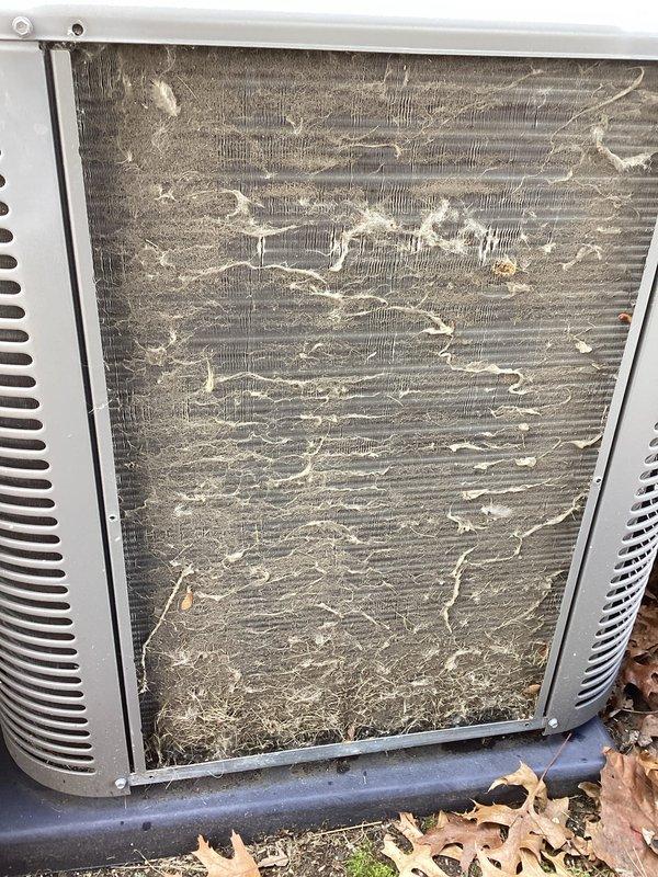 Completed annual maintenance service on residential Lennox air conditioning system. Upon arrival, found condenser unit filter screen heavily clogged with accumulated dirt, dust, and environmental debris, significantly restricting airflow and reducing system efficiency. Removed and cleaned exterior filter panel, restoring proper ventilation through unit grilles. Inspected condenser coils, refrigerant lines, electrical connections, and disconnect box. Verified proper operation of compressor and condenser fan motor. System tested and returned to normal operating condition with improved airflow capacity.