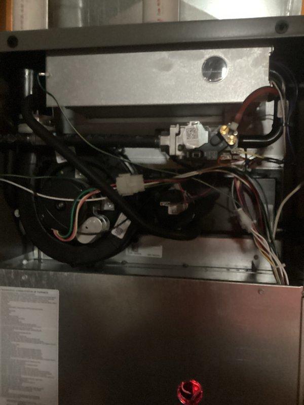 Completed comprehensive spring maintenance on Lennox forced air furnace and central air conditioning system. Performed full AC tune-up including refrigerant level verification, condenser coil cleaning, electrical connection inspection, and thermostat calibration. Inspected 1-year-old furnace components including burner assembly, heat exchanger, blower motor, gas valve connections, and all electrical wiring harnesses. Verified proper operation of ignition system, flame sensor, and safety controls. Cleaned blower assembly, replaced air filter, and tested airflow throughout system. Checked all wire connections, relays, and junction boxes for secure mounting and proper voltage. Inspected combustion chamber and confirmed all safety indicators functioning correctly. Both heating and cooling systems operating within manufacturer specifications with no issues identified. System ready for upcoming cooling season.