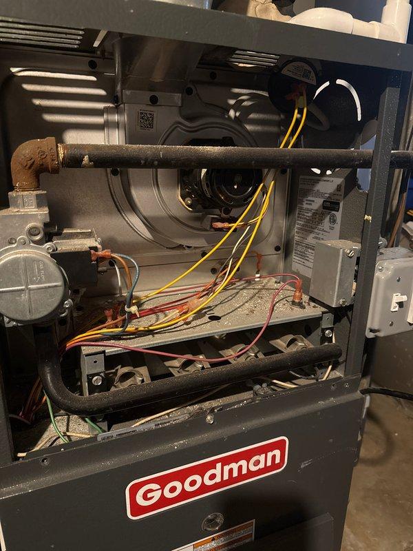 Completed comprehensive preventative maintenance inspection on Goodman HVAC system including both heating and cooling components. Performed routine air handler and condenser unit servicing, documented equipment condition with interior cabinet and outdoor coil photography showing moderate dirt accumulation on heat exchanger surfaces requiring cleaning attention. All mechanical components, electrical connections, blower motor assembly, and refrigerant lines inspected and found operational within normal parameters.