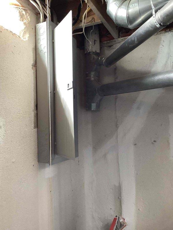 Conducted on-site evaluation for whole house generator installation at a 30-year-old single family residence. Assessed existing electrical infrastructure including main service panel located in basement and exterior electrical disconnect at HVAC unit. Photographed current electrical setup to document 200-amp service capacity and available installation locations. Evaluated gas line accessibility, clearance requirements, and optimal generator placement options to provide customer with comparative estimates for both Generac and Kohler automatic standby generator systems sized appropriately for whole house coverage.