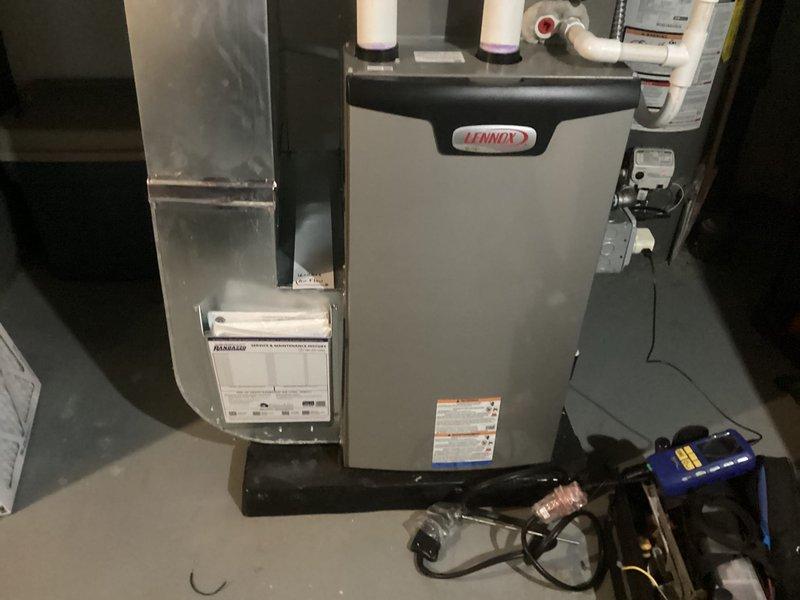 Completed annual furnace maintenance on Lennox heating system. Performed comprehensive tune-up including inspection of gas valve assembly, burner components, and heat exchanger. Verified proper operation of blower motor and checked all electrical connections and wiring harnesses. Inspected and tested exhaust and intake PVC venting system for proper draft and clearances. Evaluated humidifier operation and connections. Checked all safety controls and limit switches for proper function. Measured system temperatures and pressures to ensure equipment operating within manufacturer specifications. All components found to be functioning properly with no issues identified. System returned to normal operation.