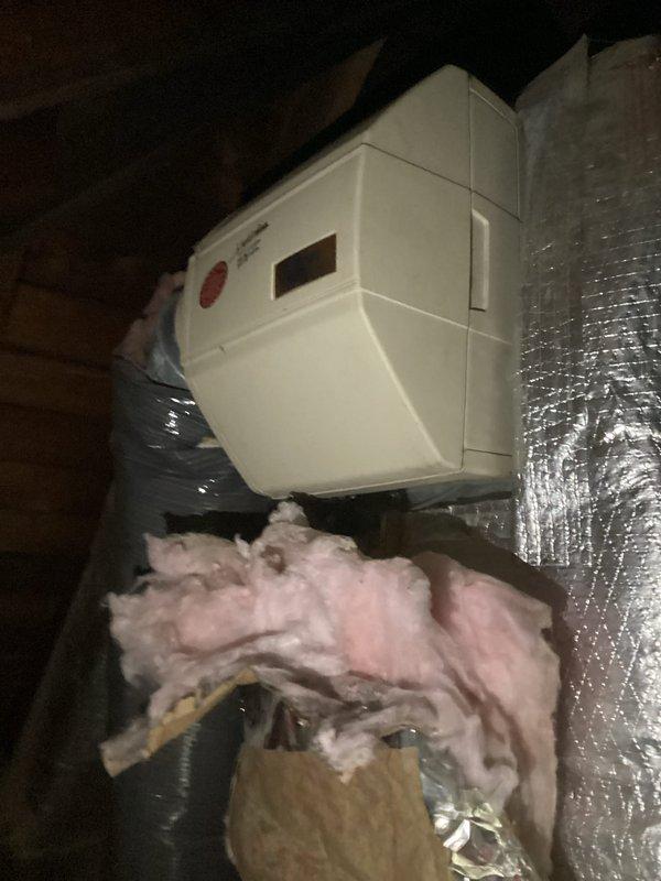 Completed annual heating maintenance tune-up on furnace system under Air Care Membership with no issues reported. Performed comprehensive inspection of furnace unit located in attic space, including examination of HVAC components, ductwork connections, and insulation integrity. System found operating properly with all components functioning within normal parameters. Documented equipment condition with photographs showing attic installation, flexible ductwork, and access point configuration for service records.