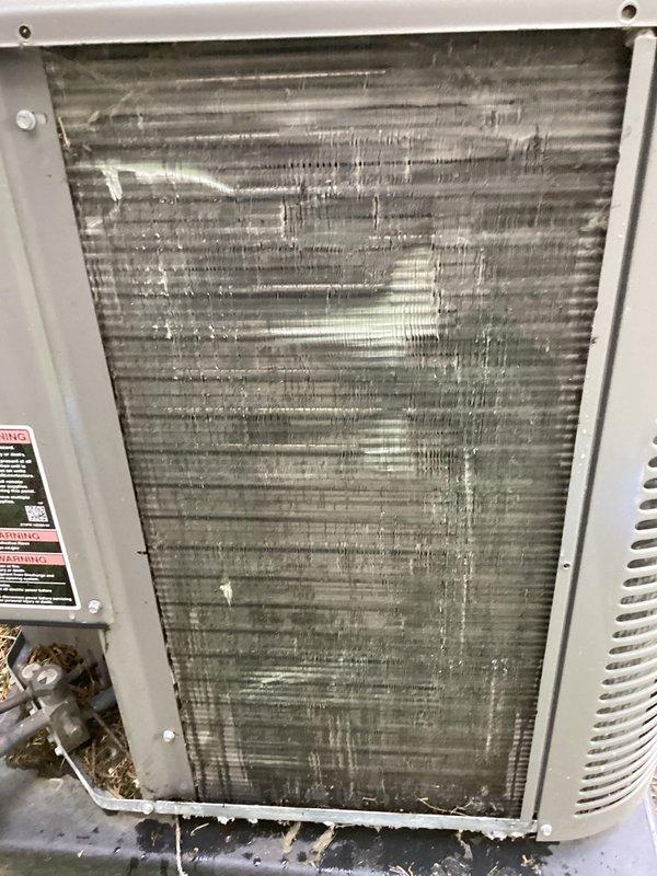 Completed comprehensive tune-up service on residential HVAC system. Performed thorough cleaning of heavily soiled outdoor condenser coil which exhibited significant accumulation of dust, debris, and particulate matter restricting airflow. Cleaned indoor evaporator coil that displayed extensive buildup of lint, household dust, and fibrous materials throughout fin surfaces. Replaced air filter and verified all system components operating within normal parameters upon completion.