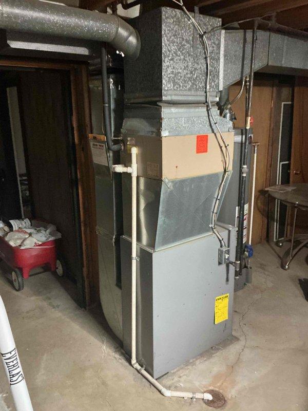 Completed on-site HVAC estimate for replacement of 16-year-old air conditioning system. Evaluated existing furnace and AC installation in basement, documented electrical panel configuration and circuit breaker setup, assessed ductwork condition and connections, and photographed current equipment layout to provide comprehensive replacement quote for immediate system upgrade.