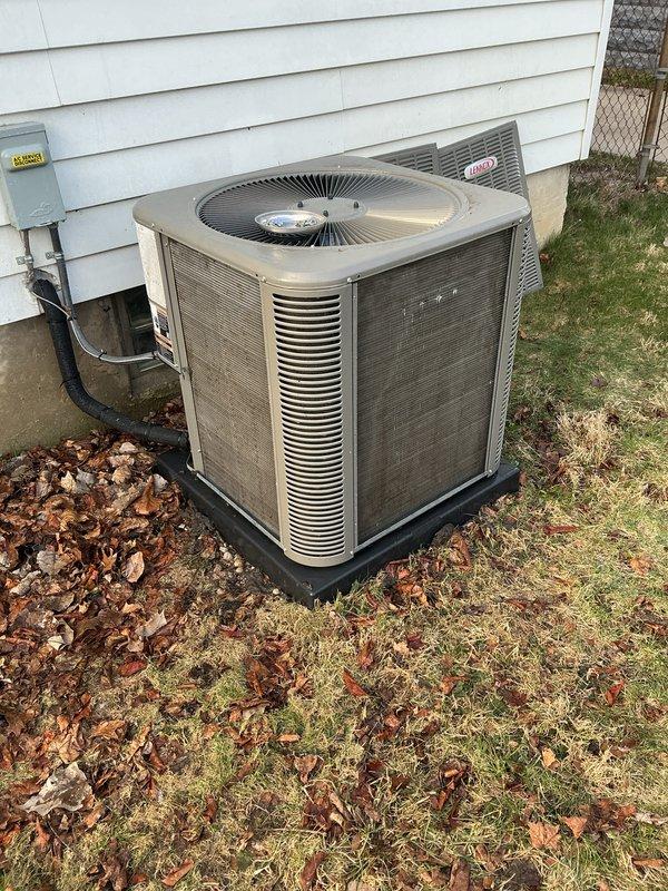 Completed scheduled preventive maintenance on residential Lennox air conditioning condenser unit. Performed comprehensive system inspection including visual assessment of exterior housing, electrical disconnect, conduit connections, and mounting pad. Unit found in operational condition with normal weathering and minor debris accumulation around perimeter. All components intact and properly installed with no visible damage or immediate service concerns noted.