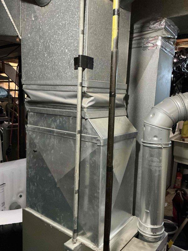Completed HVAC estimate for air conditioning system installation at residential property with 20-year-old natural gas furnace currently in service in basement location. Assessed existing equipment configuration, ductwork connections, and available space for potential A/C addition, while also evaluating furnace replacement options per customer interest in comprehensive system upgrade.